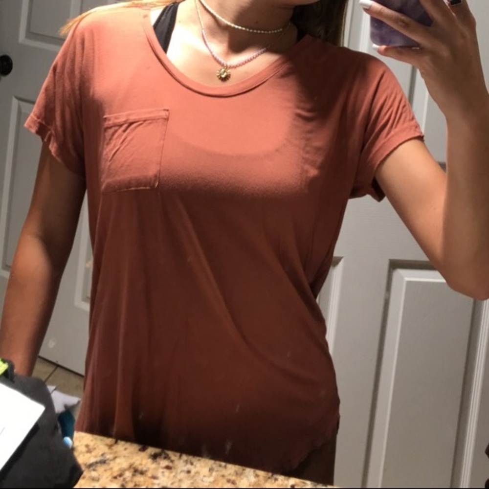 Worn once , pumpkin colored pocket T